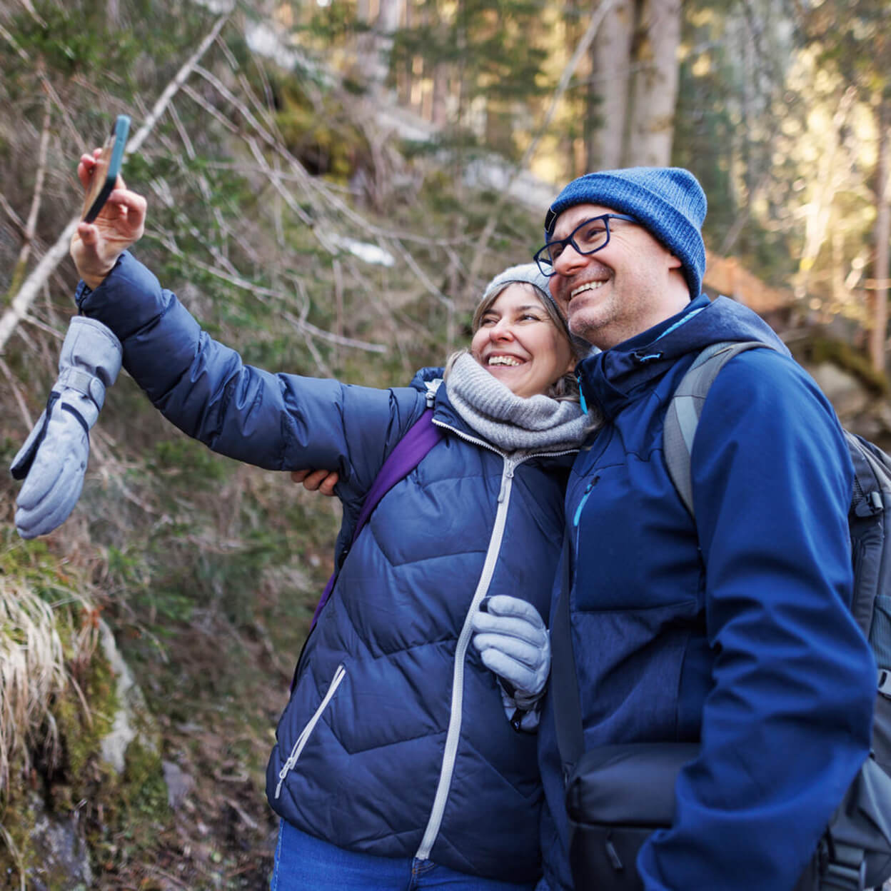 A couple take a selfie while hiking